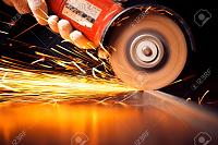 Lots of paint chips on rear side-27921651-worker-cutting-metal-grinder-sparks-while-grinding-iron-stock-photo-jpg
