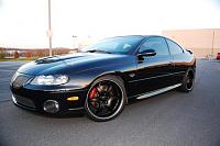 black GTO with new paint on hood.  Micro marring problems.-13-jpg