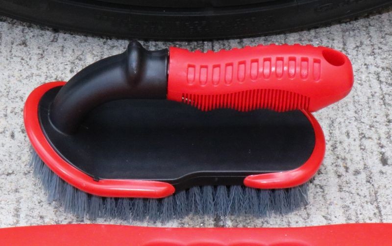 Speed Master Tire Brush features a ribbed handle.