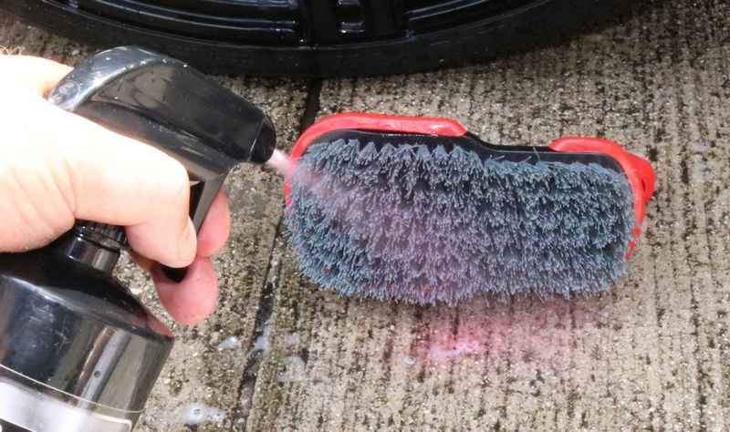Spray BLACKFIRE Tire & Wheel Cleaner onto a Speed Master Wheel Scrub Brush.
