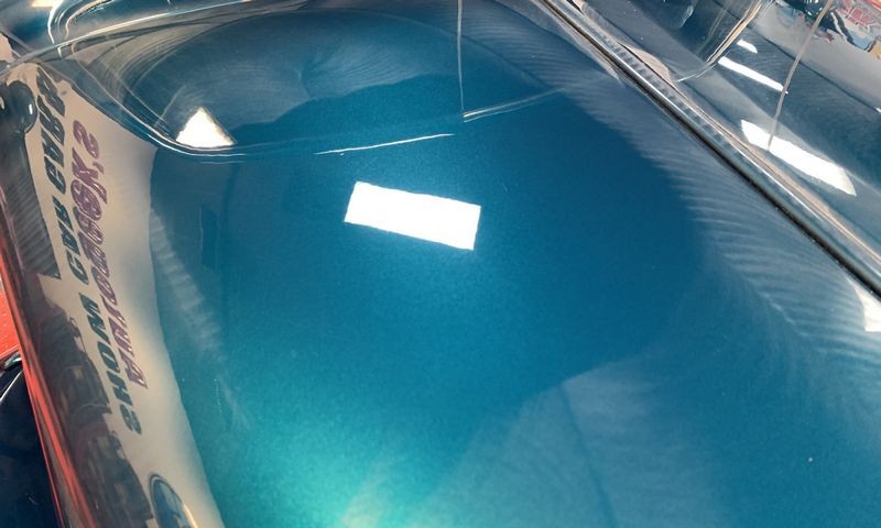 Section of buffed paint showing paint defects removed new angle.
