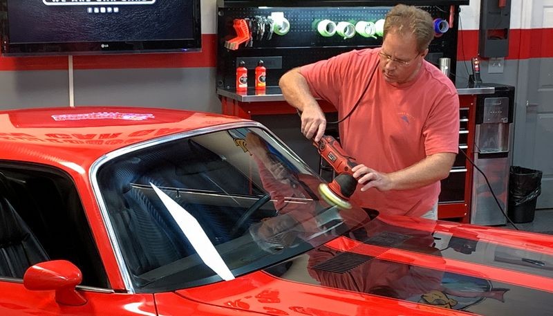 Mike Phillips polishing glass on car with Griot's Garage Polisher
