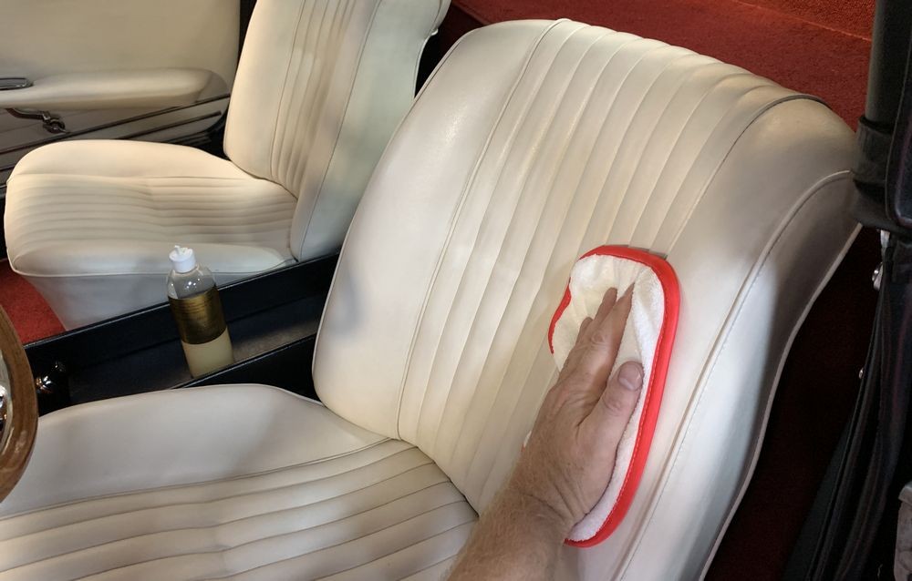 Applying Prestine Clean to leather surfaces.