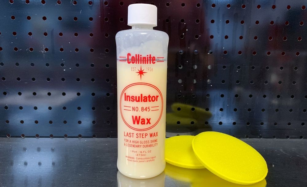 Collinite bottle on table with yellow applicator pads.