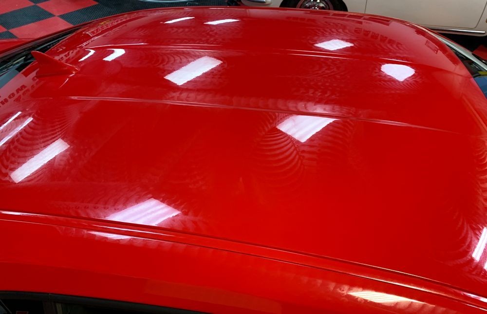 Hood of car after wax is applied.