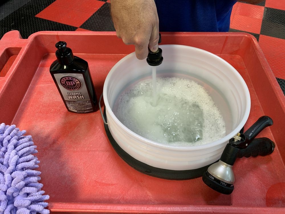 A strong jet of water activates the suds of DP Ceramic Wash.