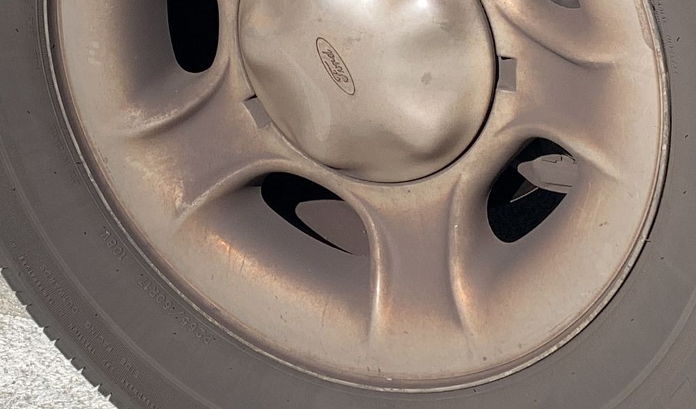 Baked on road grime on wheel.