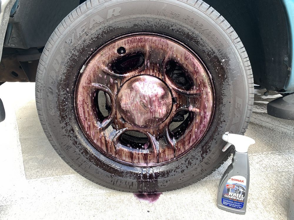 SONAX Wheel Cleaner Plus turns red as it reacts to ferrous material.