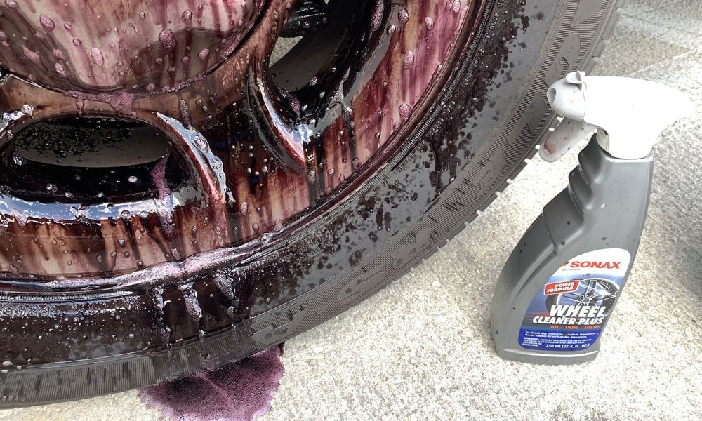 SONAX Wheel Cleaner Plus turns red as it reacts to ferrous material.
